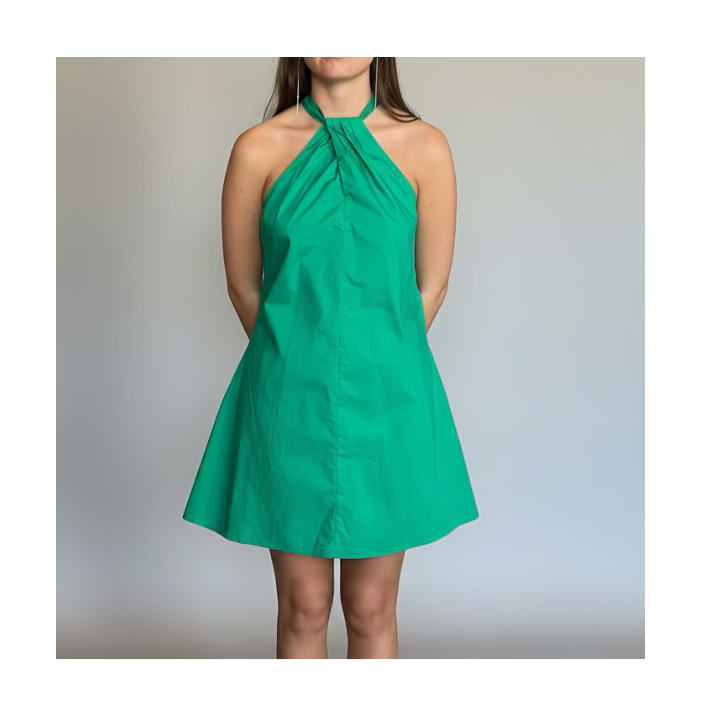 Green halter dress on a plain background