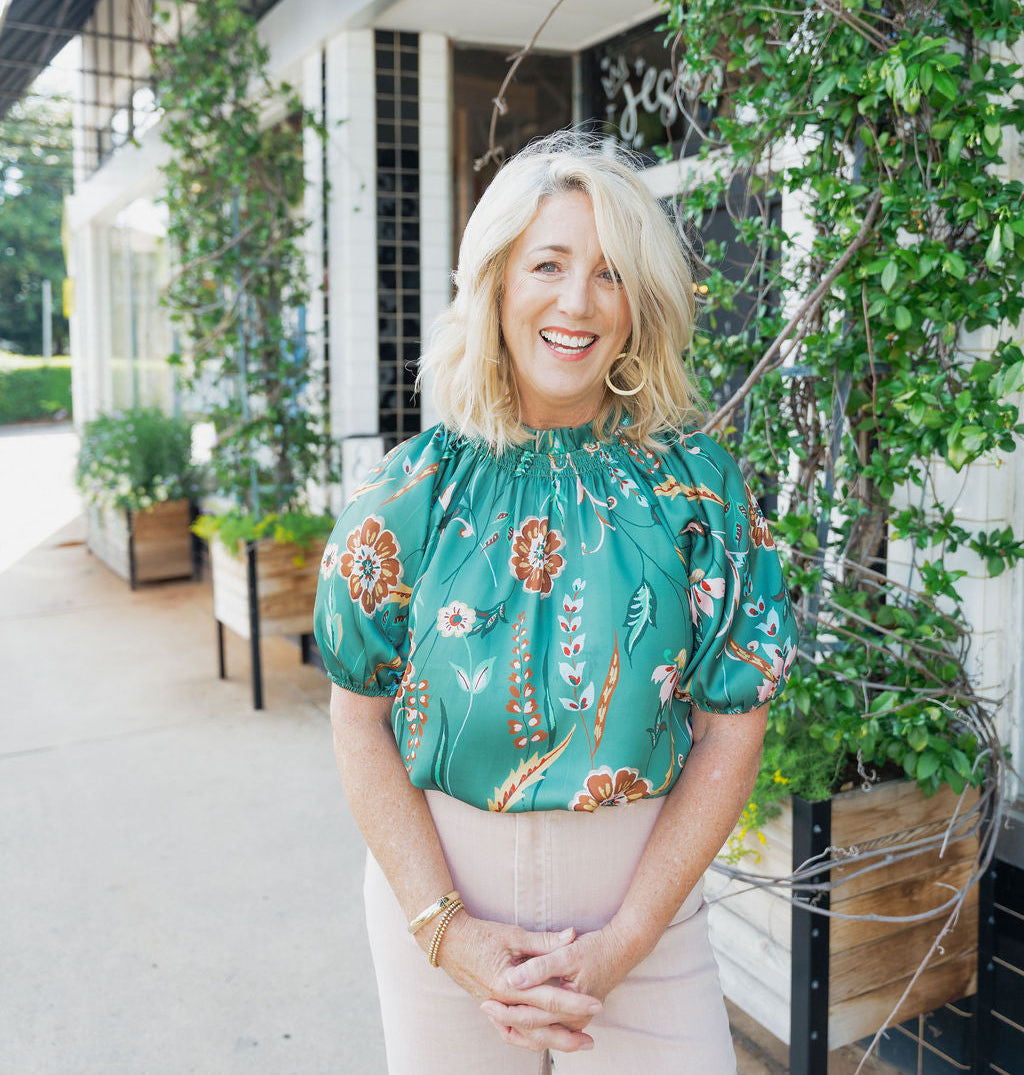 Dara, our founder, standing in front of the store.