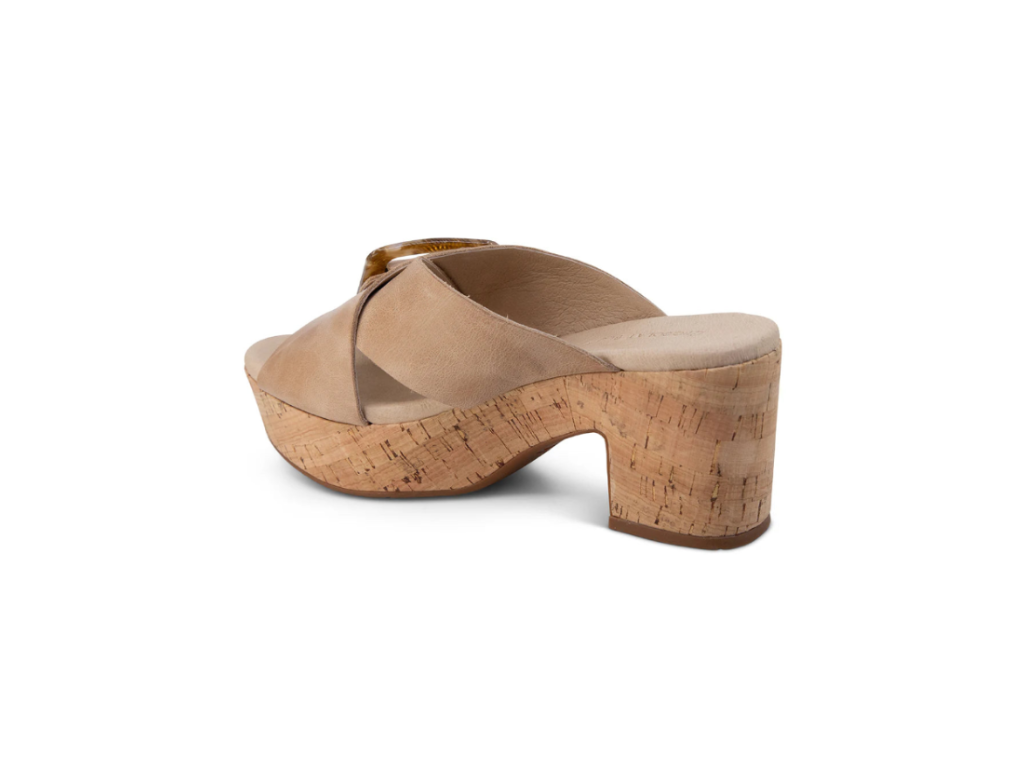  A beige platform slide sandal with cork-wrapped heel and crisscross leather straps.