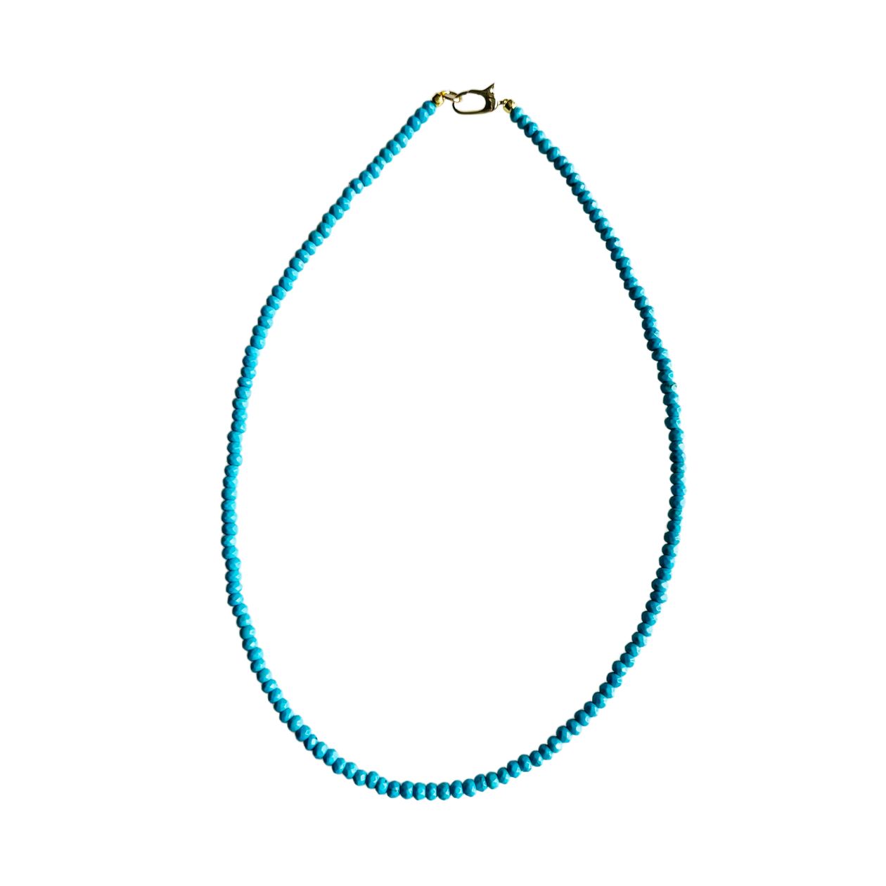Turquoise beaded necklace on a white background