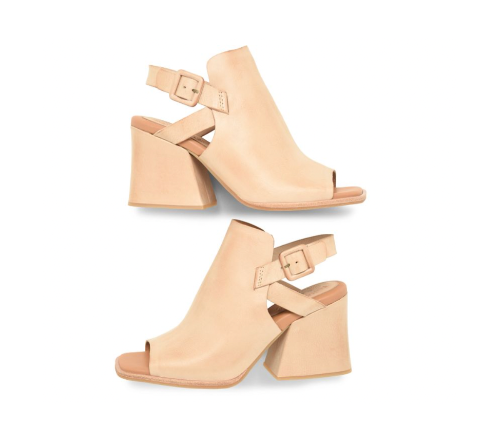 Pair of beige open-toe heeled shoes on a white background