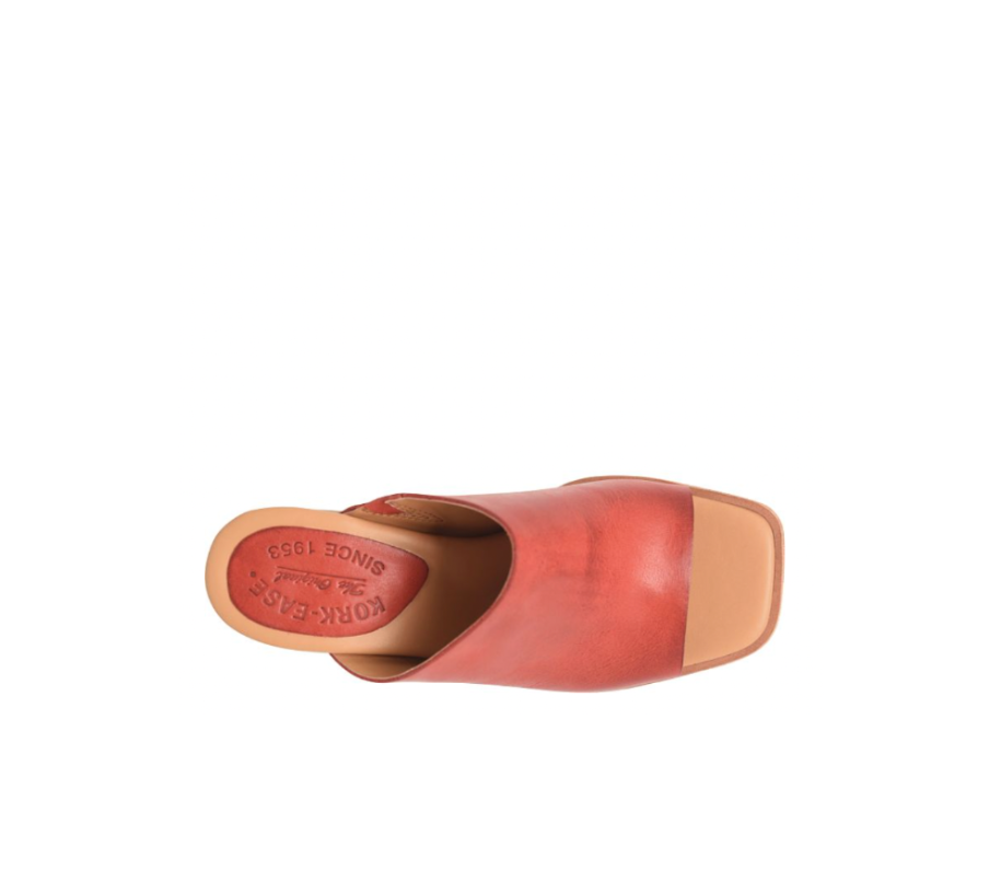 Red clog shoe with brown sole on a white background