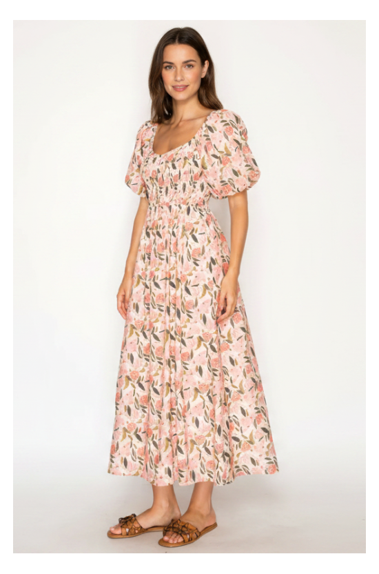 Woman wearing a floral dress on a white background