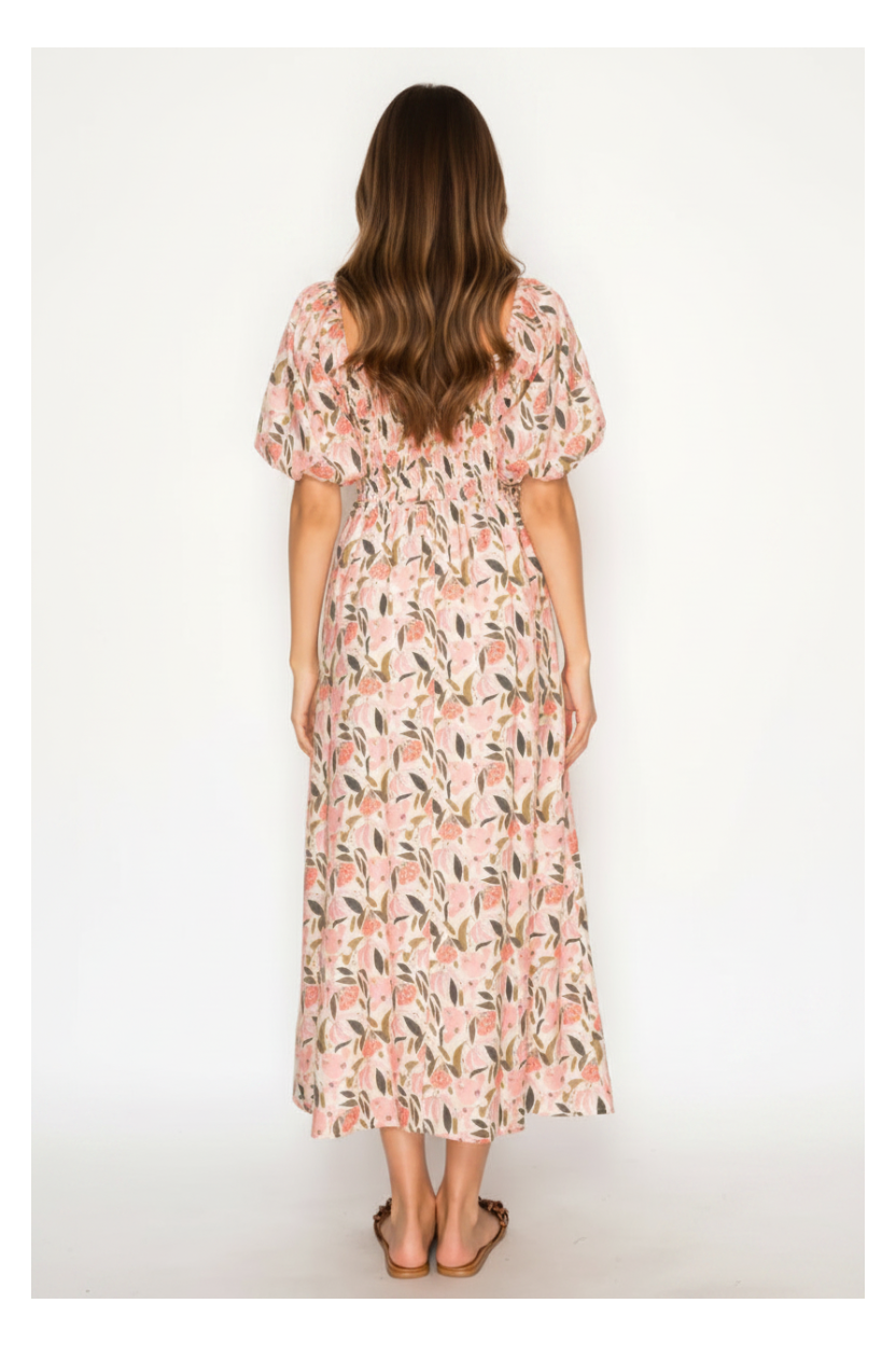 Woman wearing a floral dress on a white background