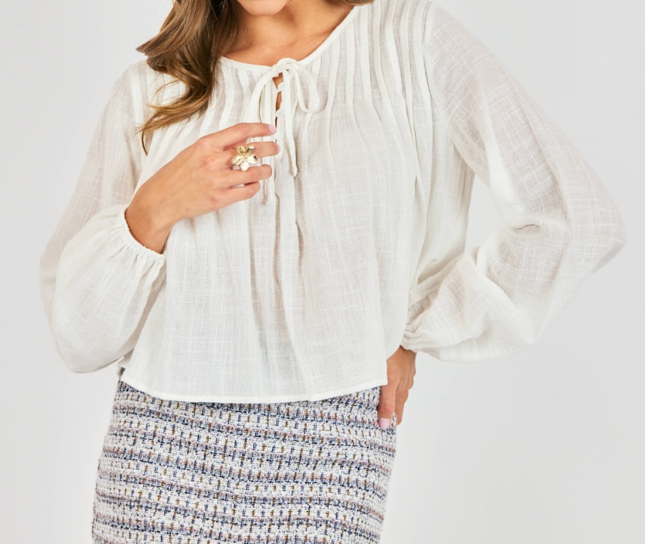 White long sleeved striped shirt with bow