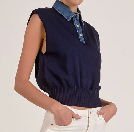 Navy sleeveless sweater with denim collar worn by a person on a plain background