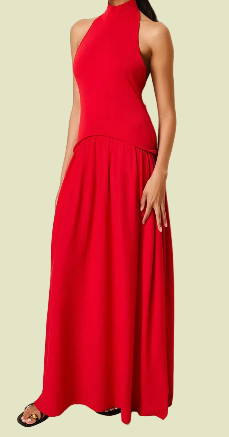 Red halter neck dress worn by a person against a beige background
