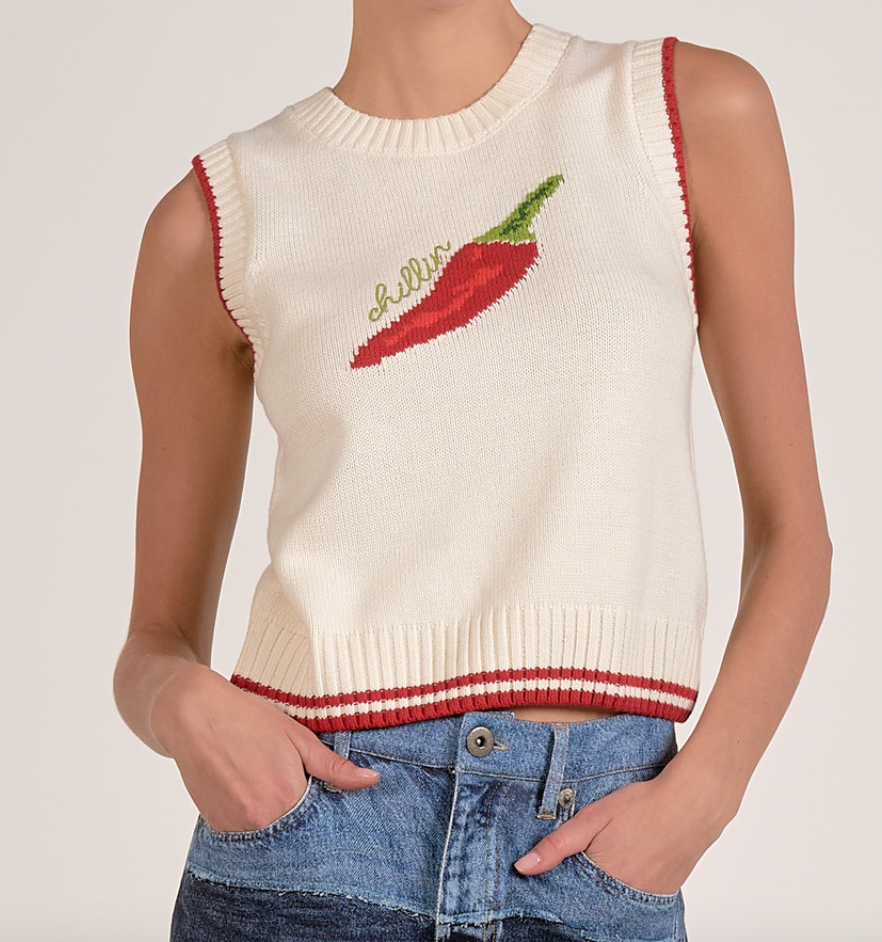 White sleeveless knit top with red chili pepper design on a plain background