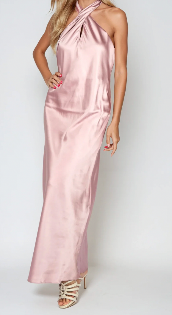 Pink satin halter neck gown on a white background