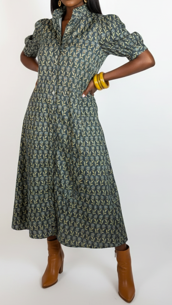 Woman wearing a patterned dress on a white background