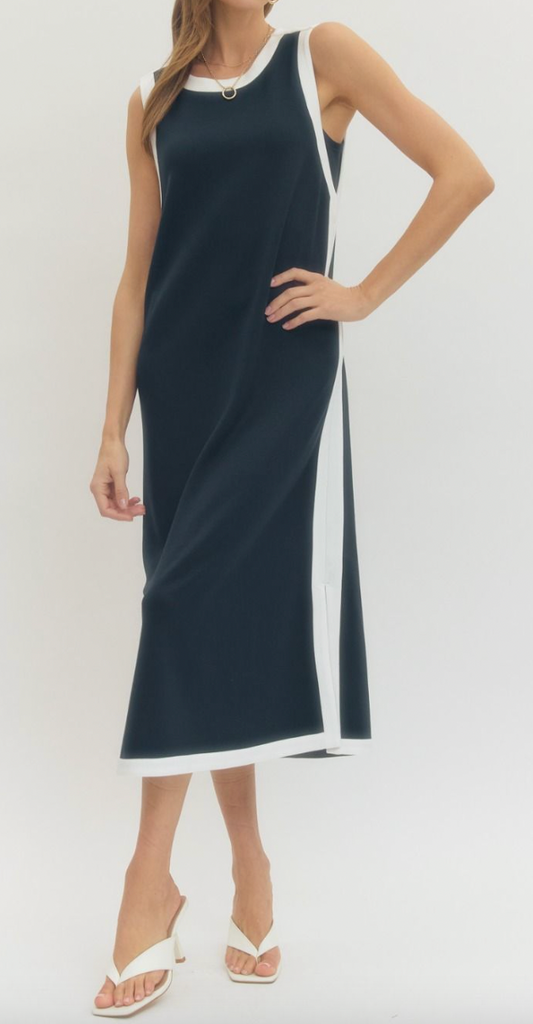 Woman wearing a black and white dress on a white background