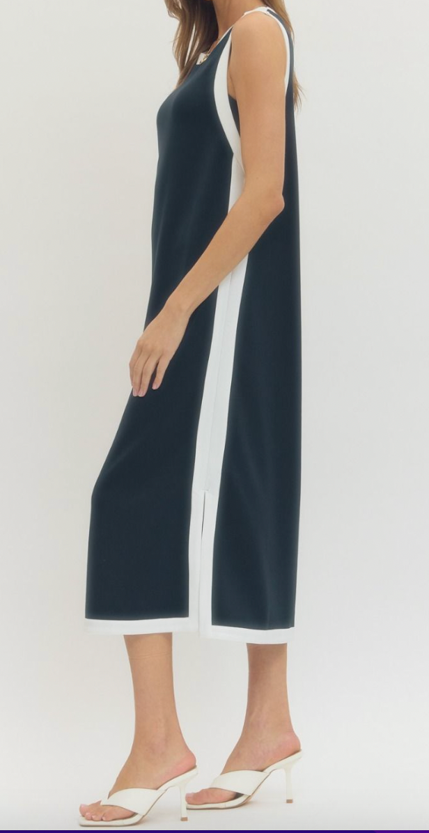 Navy sleeveless dress with white trim on a white background