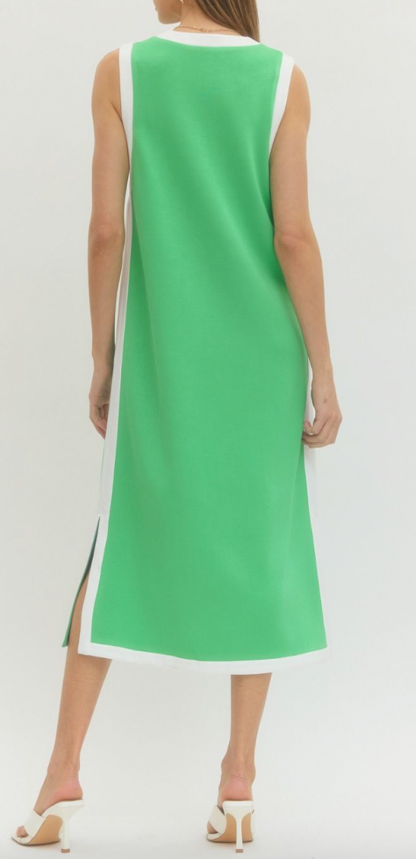 Green sleeveless dress with white accents on a white background