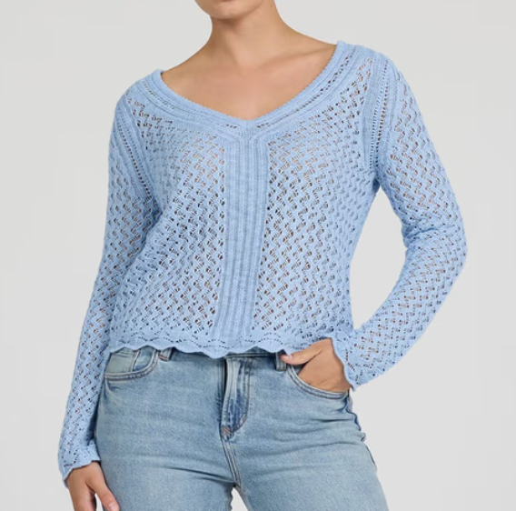 Light blue crochet top worn by a person on a plain background