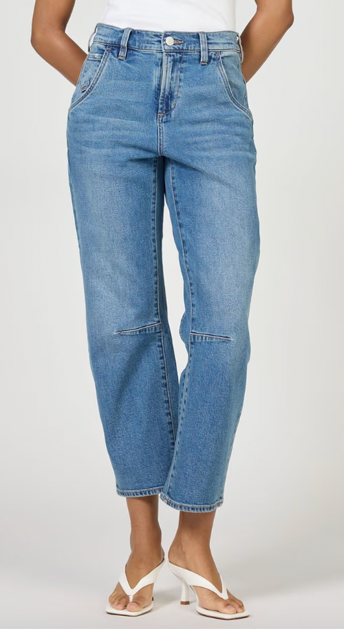 Person wearing blue jeans on a white background