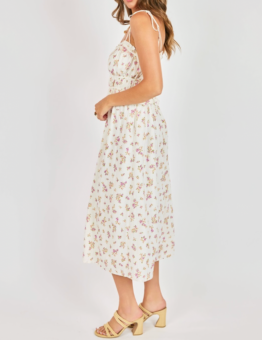Woman wearing a floral dress on a white background