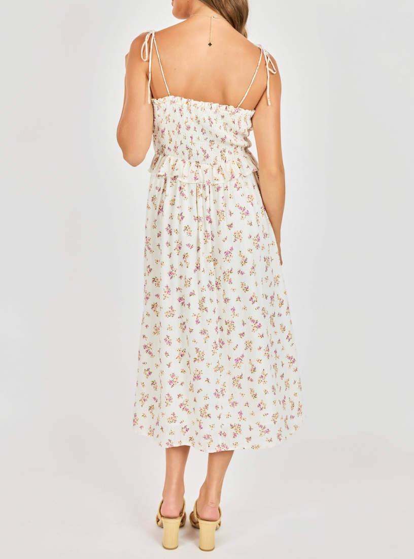 Woman wearing a floral dress on a white background