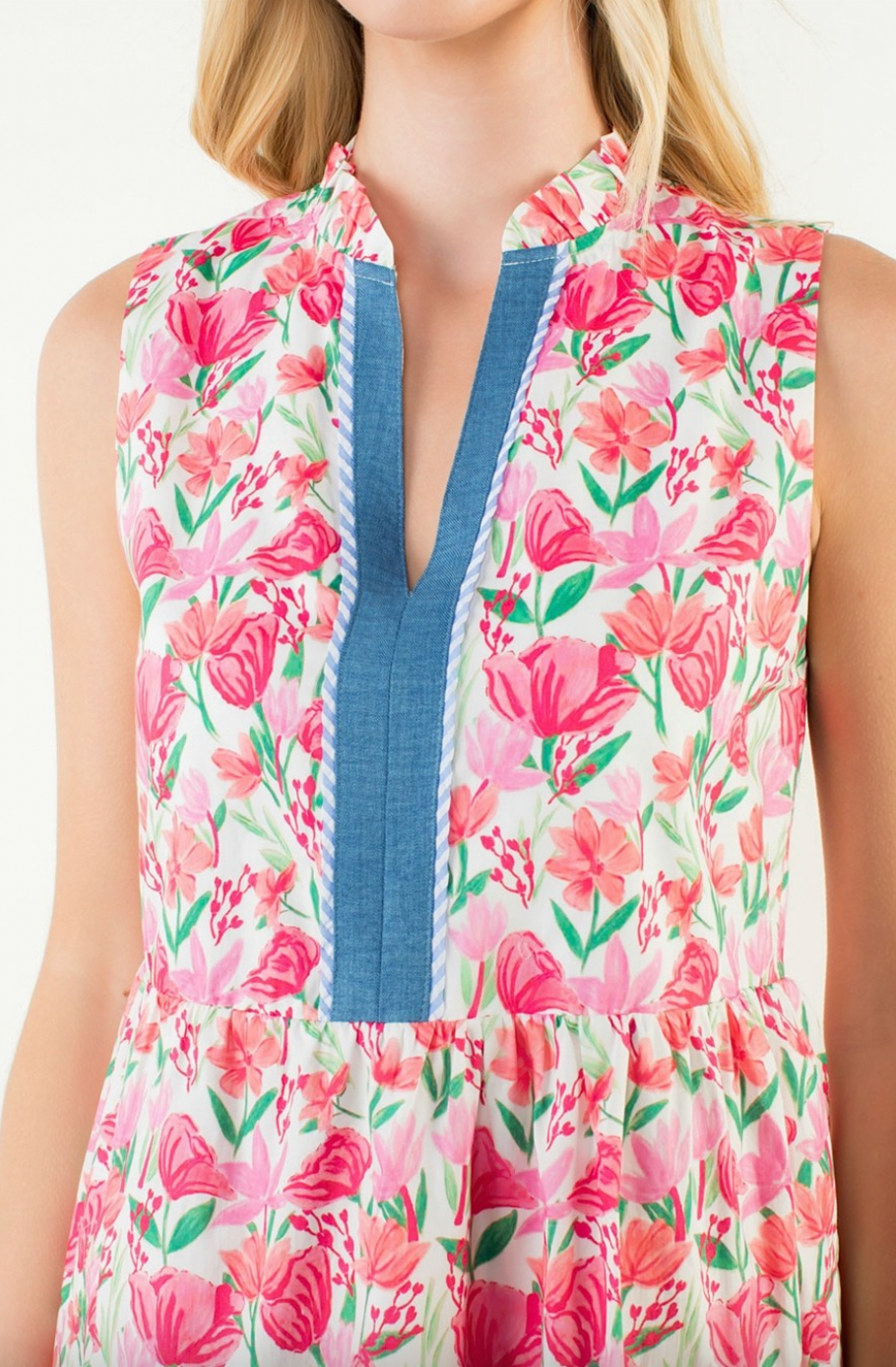 Floral dress with a blue neckline worn by a person