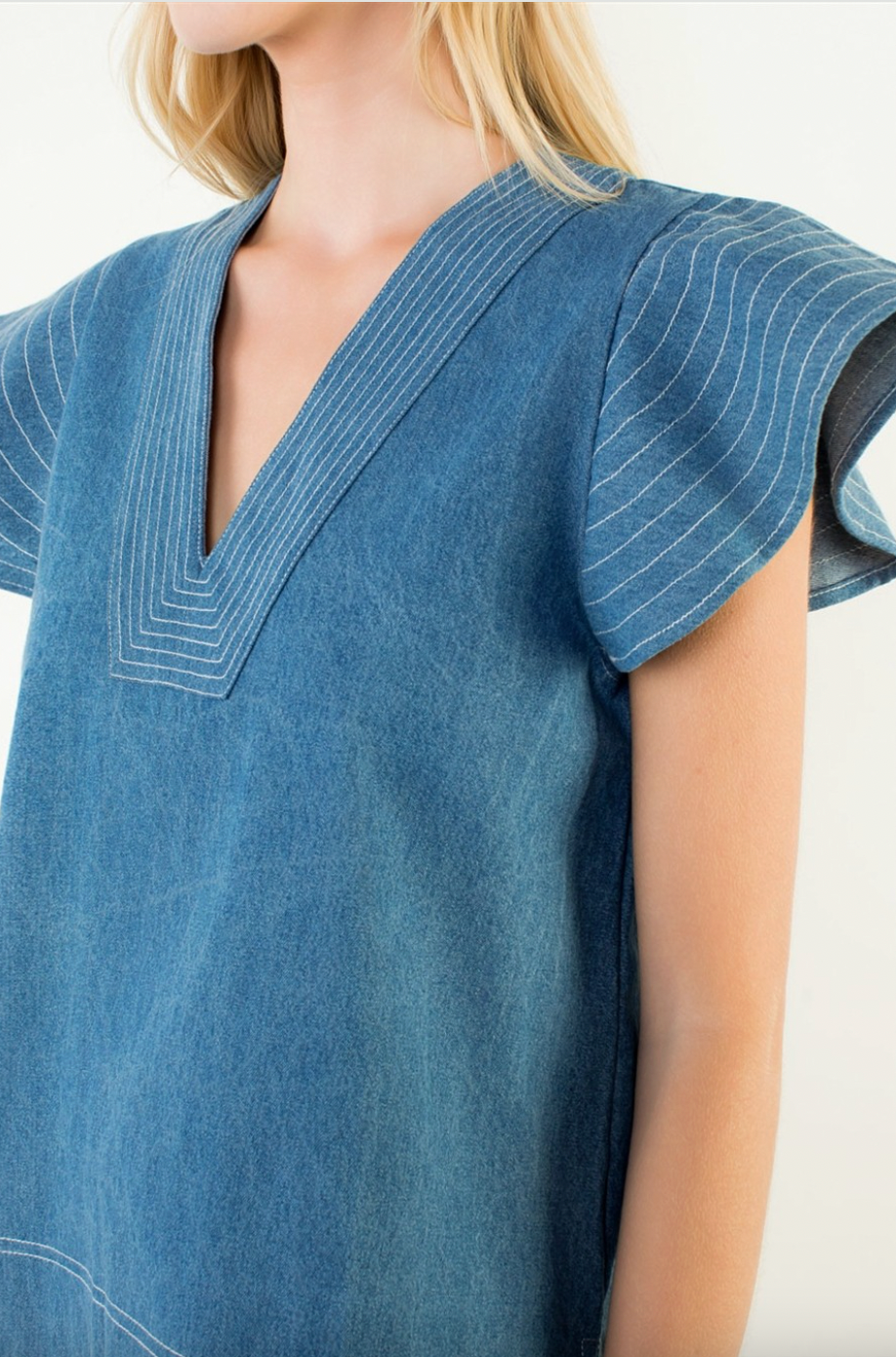 Blue dress with a V-neckline on a white background