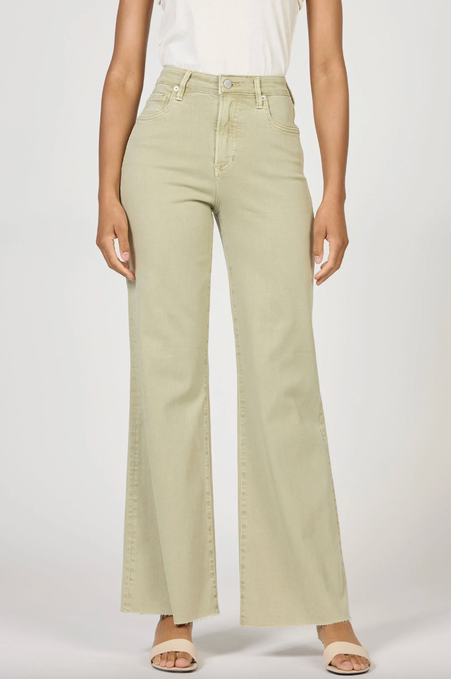 pastel green wide legged denim pants on model with white background