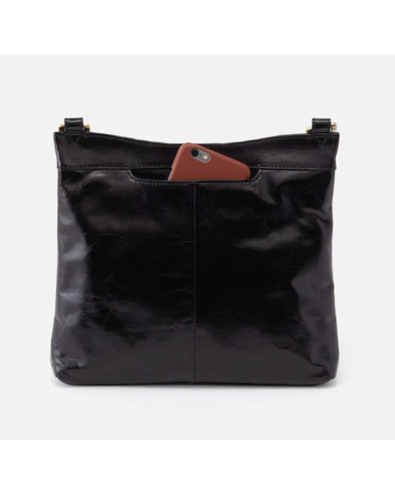 Black leather handbag with a brown phone case on a white background