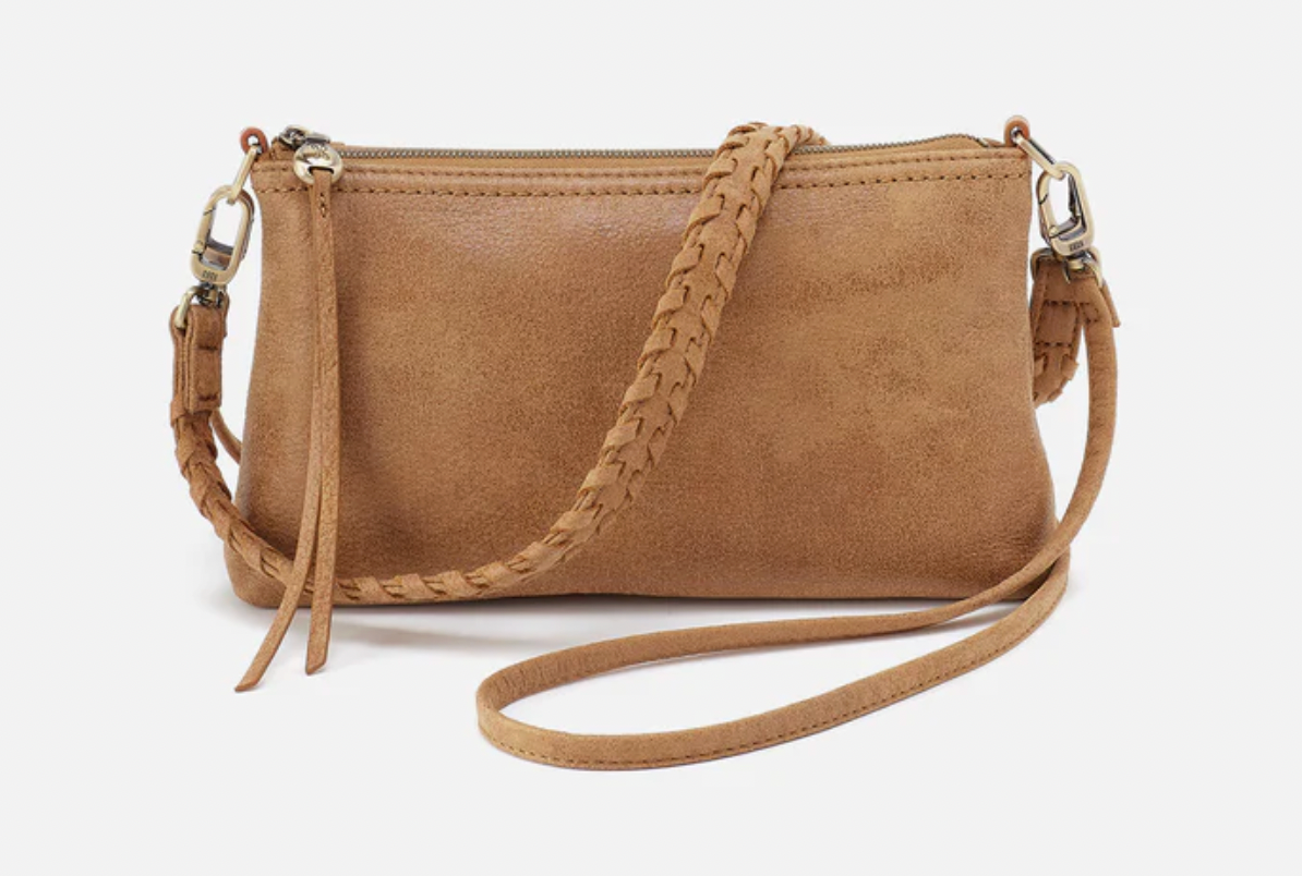 Tan handbag with a braided strap on a white background