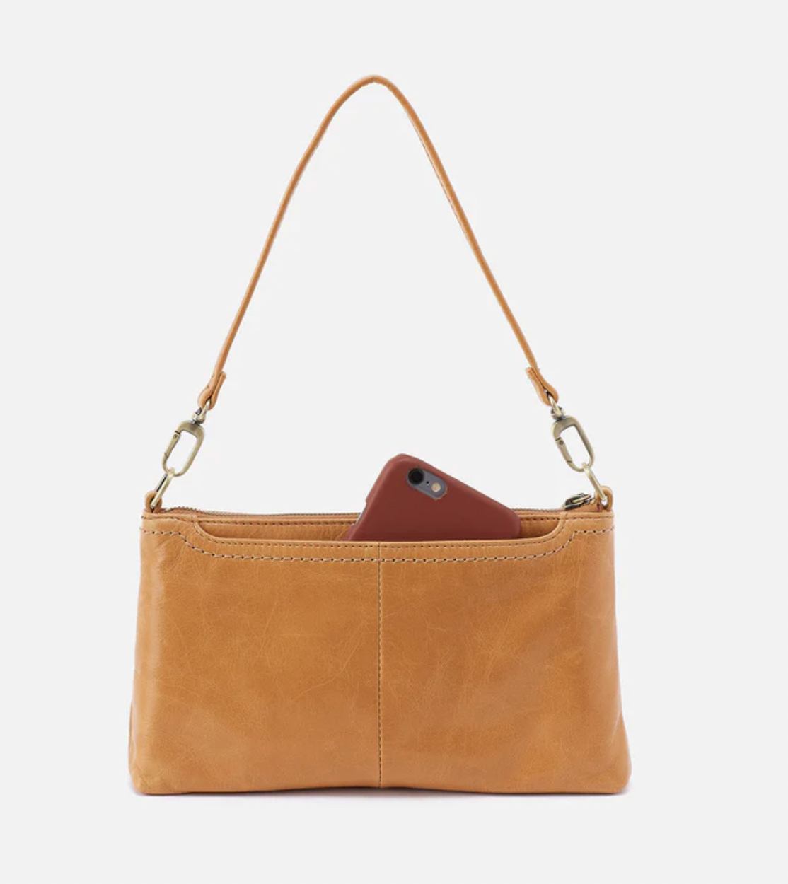 Tan leather crossbody bag with a phone inside on a white background