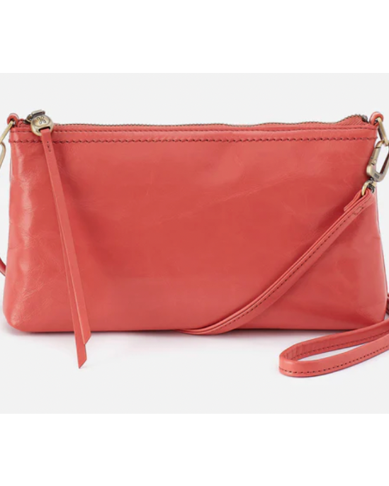 Pink leather crossbody bag on a white background