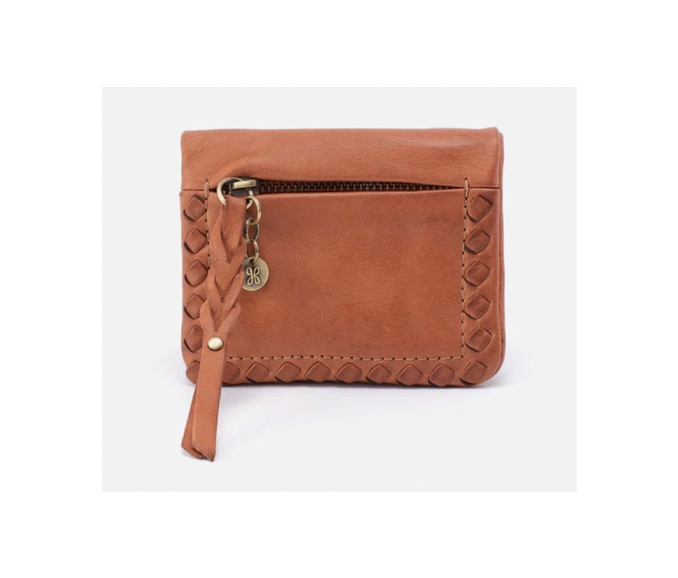 Brown leather wallet with strap and decorative elements on a white background