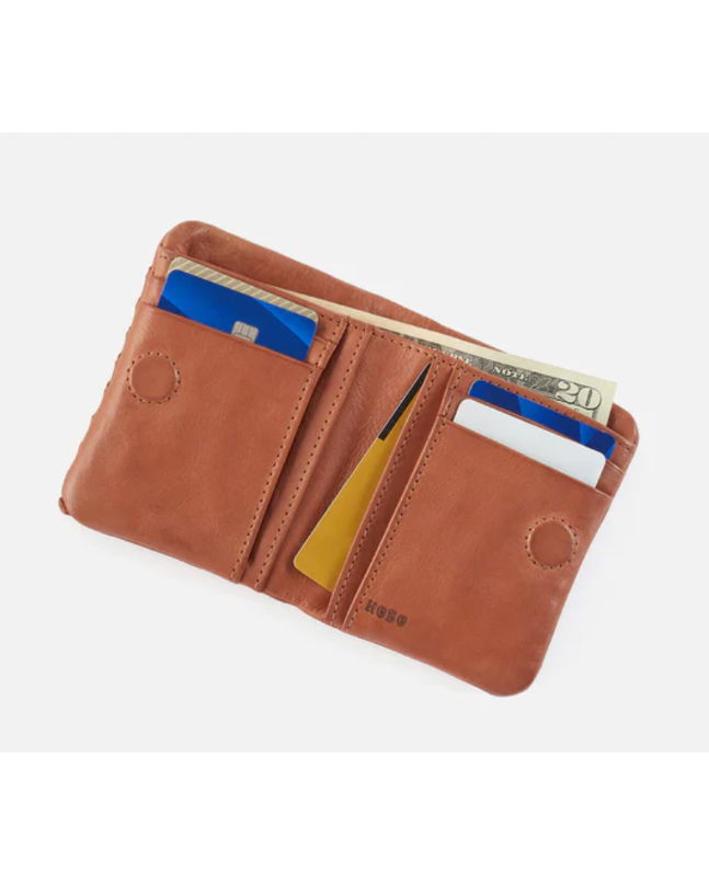 Brown leather wallet with card slots and cash pocket on a white background