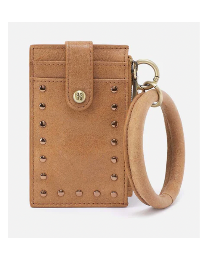 Tan studded wallet with wrist strap on a white background