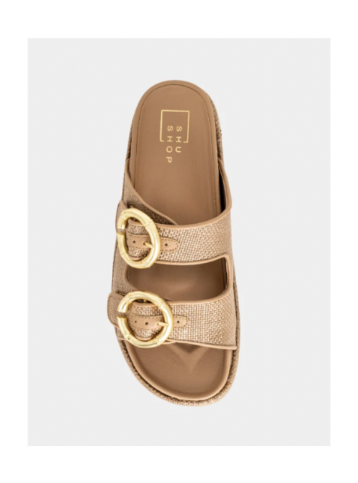 Gold sandal with buckles on a light gray background
