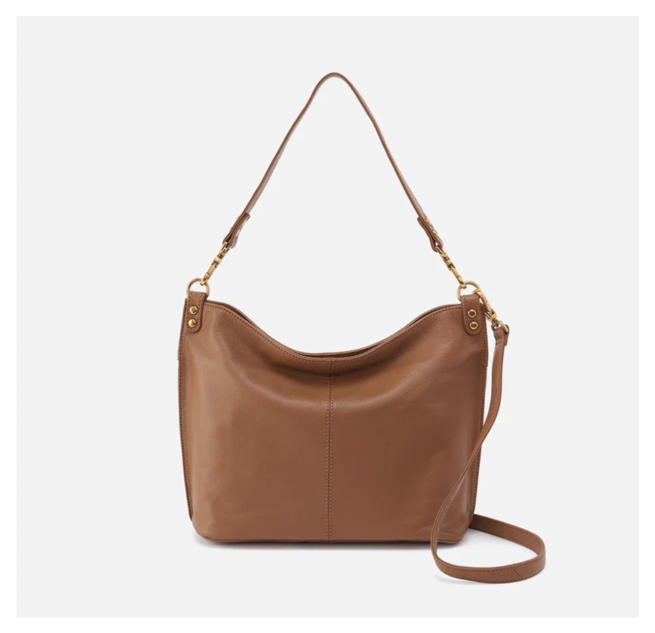 Brown leather handbag with a strap on a light gray background