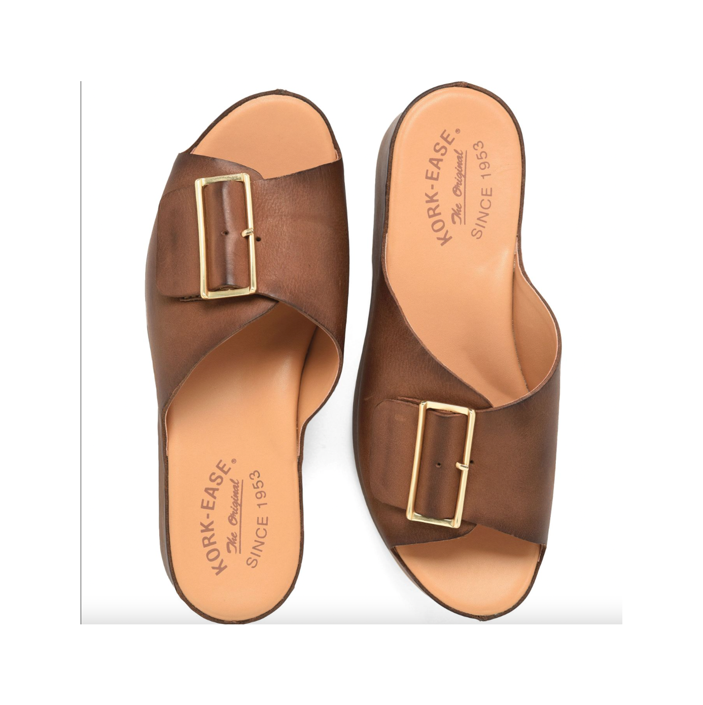 Pair of brown leather sandals with gold buckles on a white background
