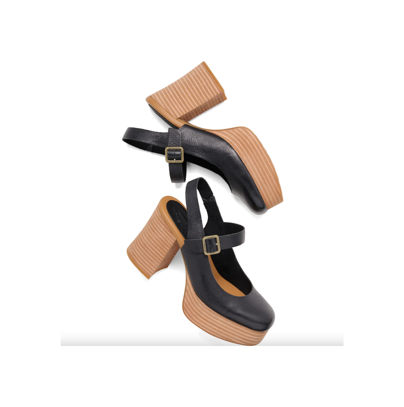 Black high-heeled shoes with brown soles on a white background