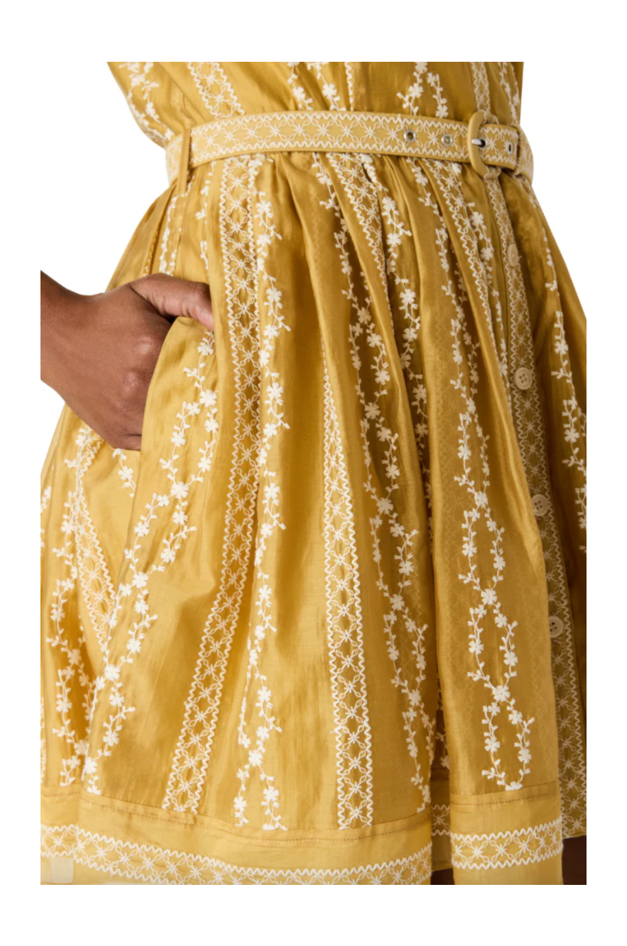 Yellow dress with white floral embroidery on a white background