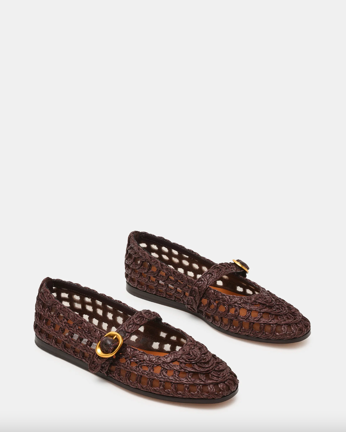 Pair of brown woven shoes with a gold buckle on a white background