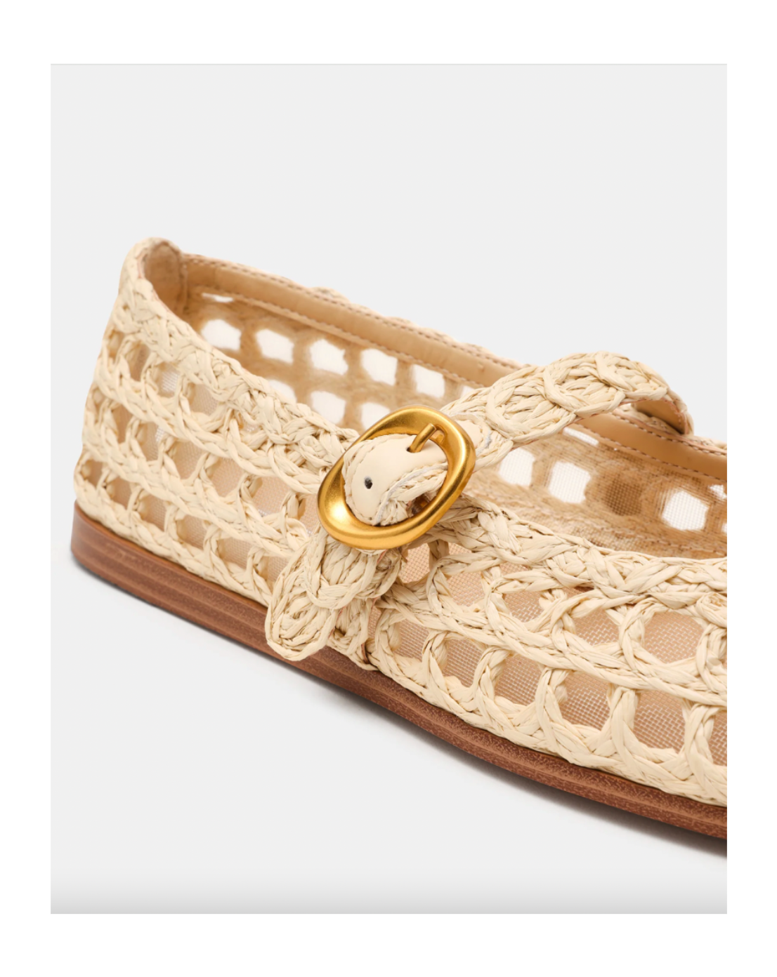 Beige woven shoe with a gold buckle on a white background