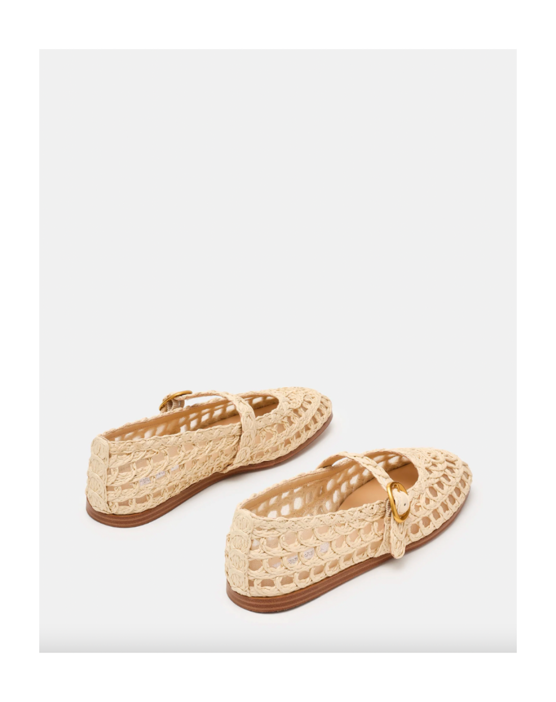 Pair of beige lace shoes on a white background