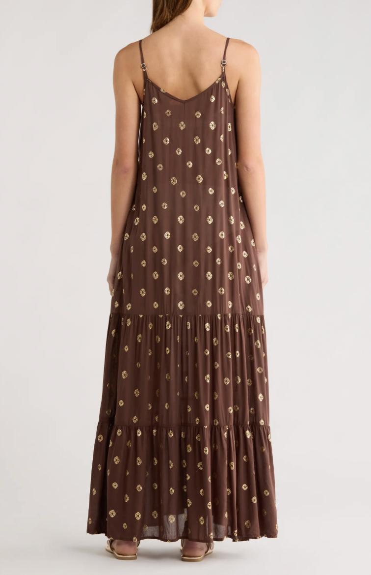 Brown dress with floral pattern worn by a person on a white background