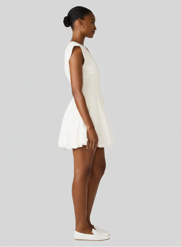 Woman wearing a white dress on a white background
