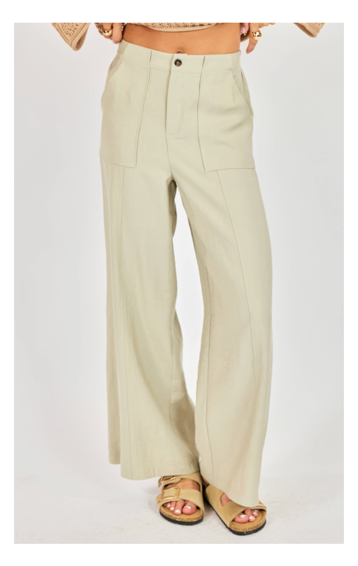 Beige wide-leg pants worn by a person on a white background
