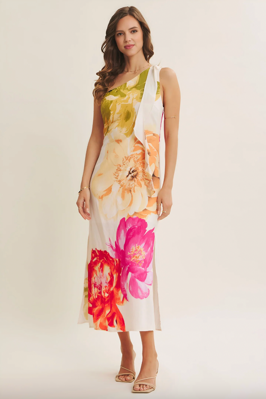 Woman wearing a floral dress on a plain background