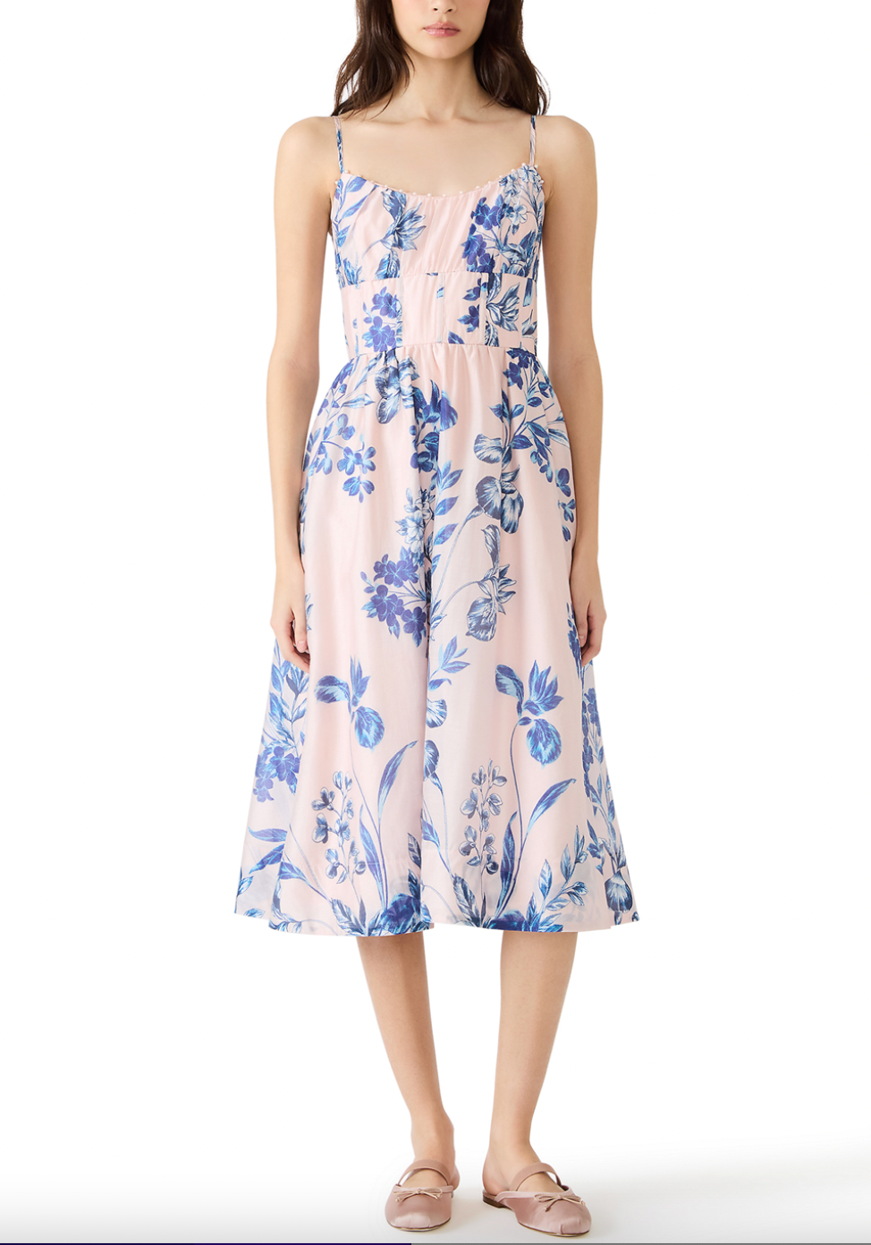 Woman wearing a floral dress on a white background