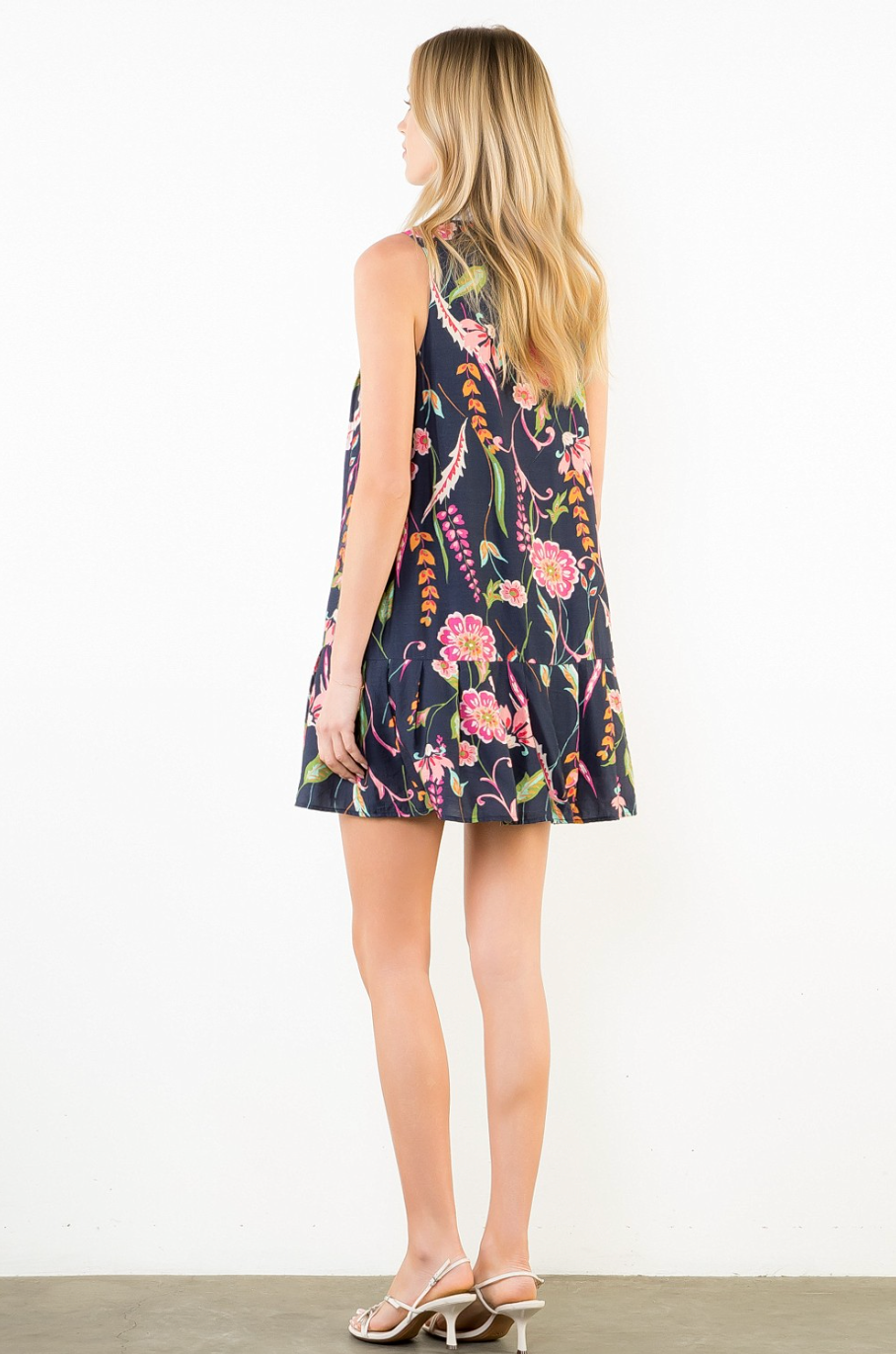 Woman wearing a floral dress on a white background