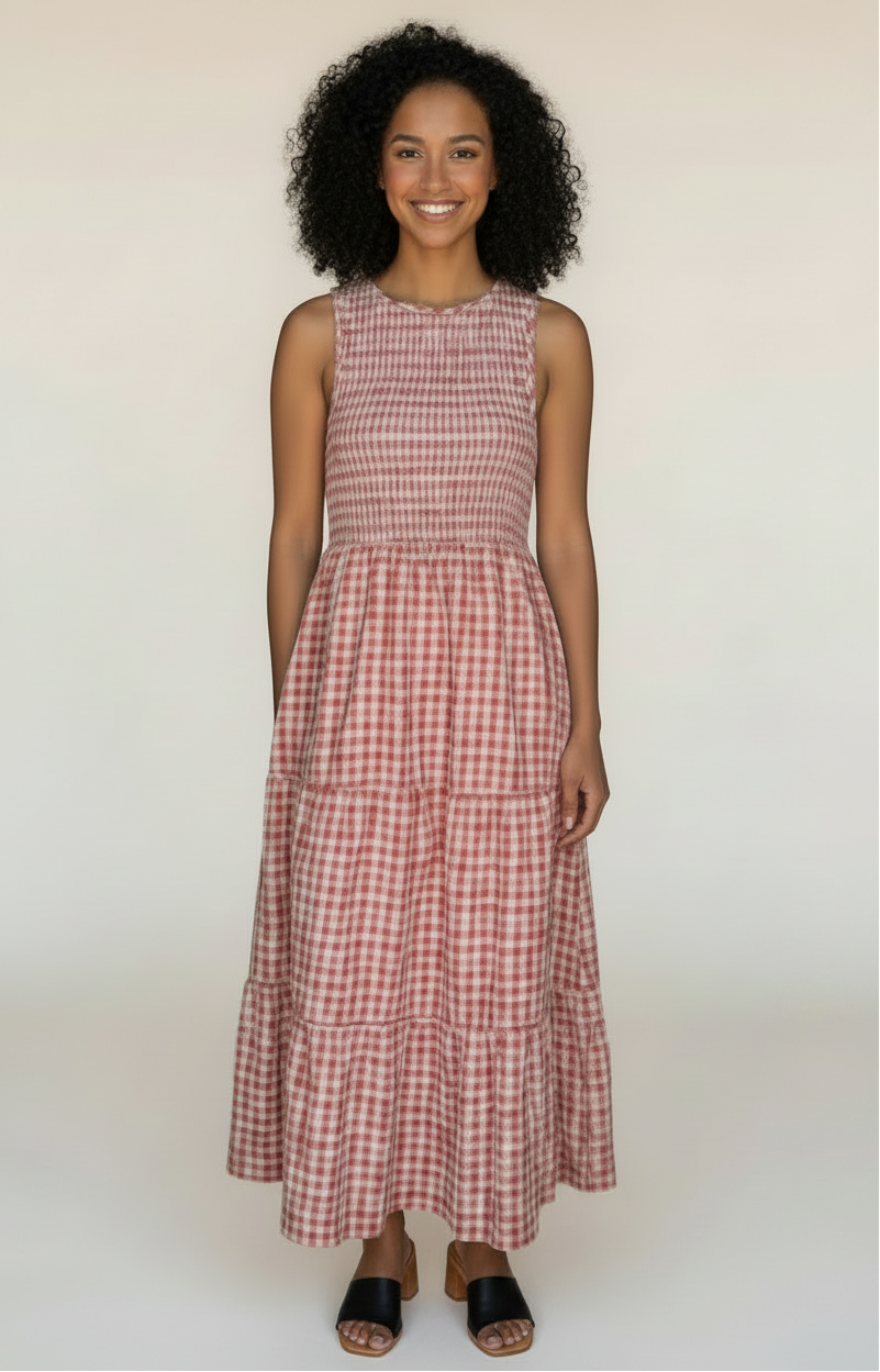 Woman wearing a red and white checkered dress in a store setting