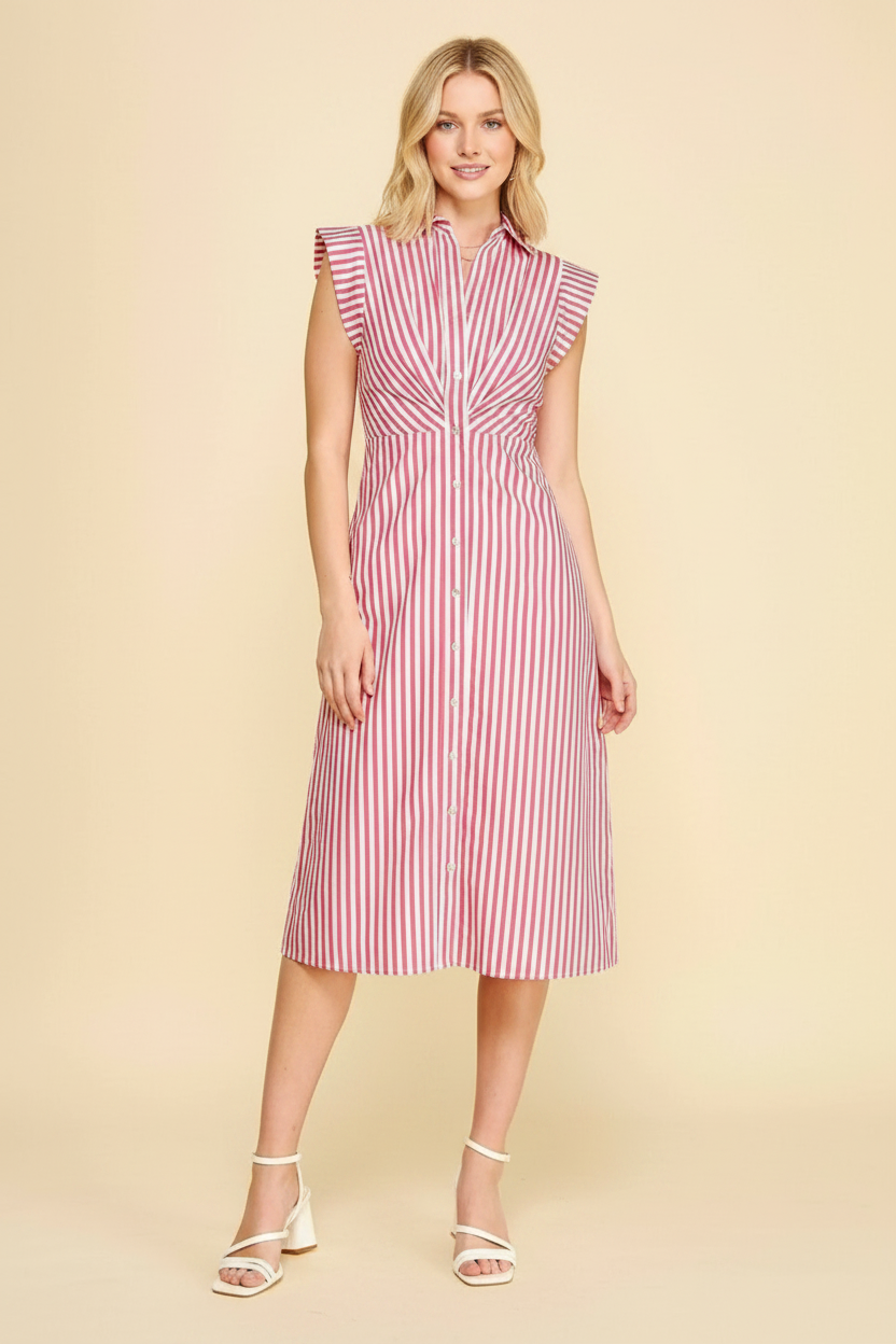 Woman wearing a red and white striped dress on a beige background