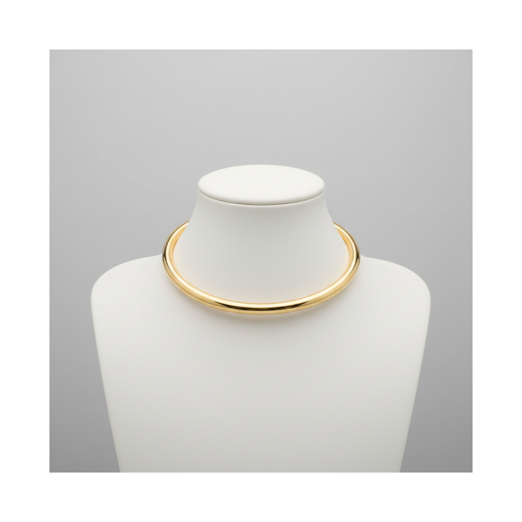 Gold necklace on a white mannequin bust against a gray background