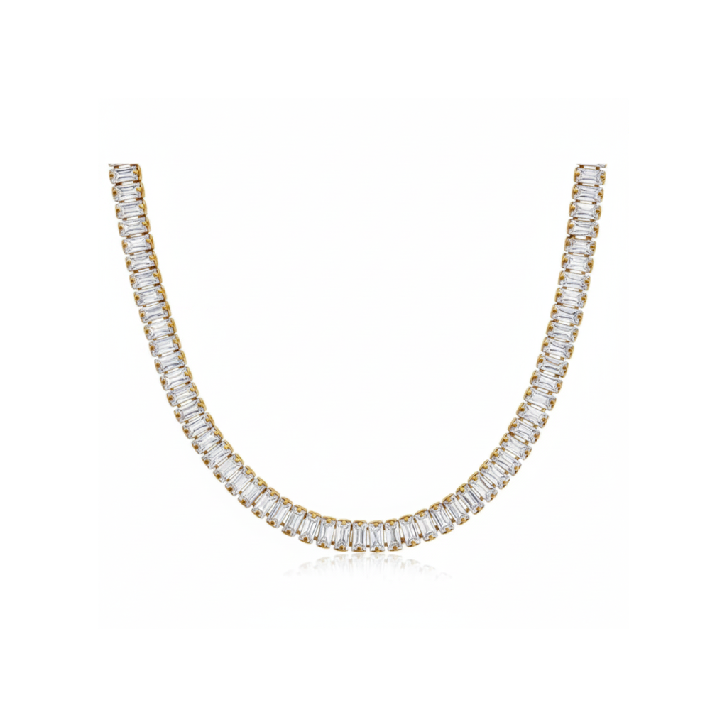 Gold necklace with clear gemstones on a white background