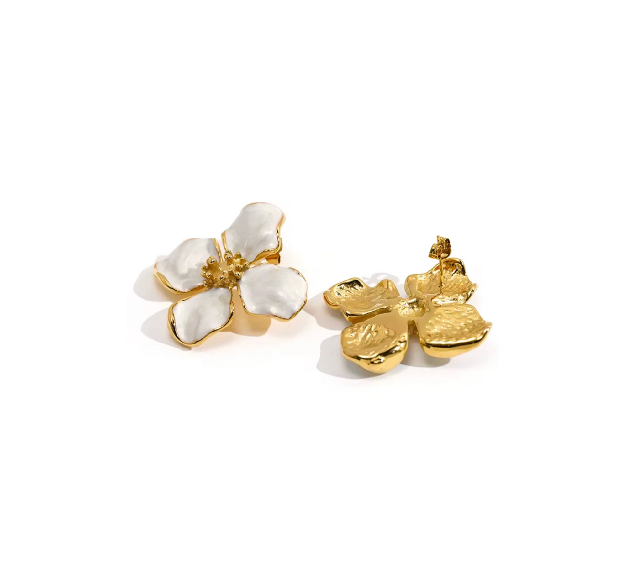 Pair of gold and white floral earrings on a white background